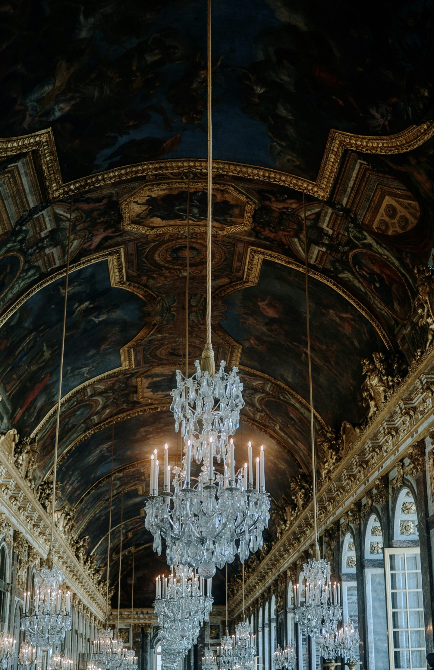 Gothic grandeur in motion: ornate detailing, shadowed ceilings, and crystal chandeliers define dark romantic luxury